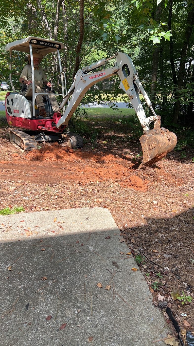 Mini excavator on a septic job