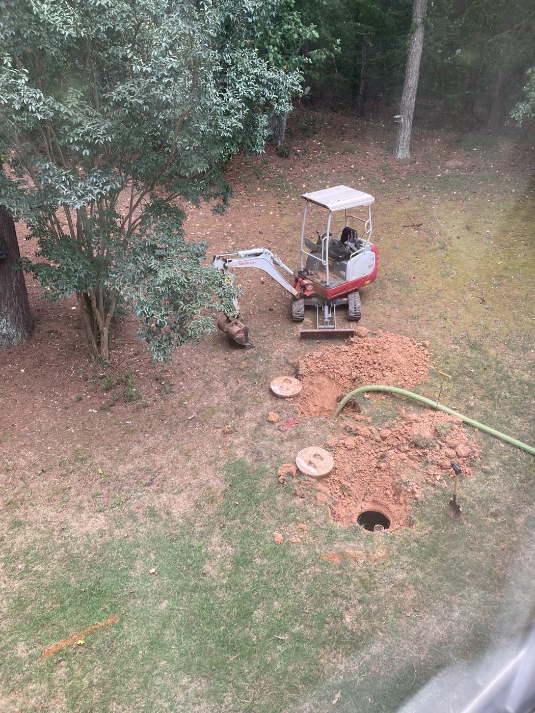 Excavator at work in a back yard